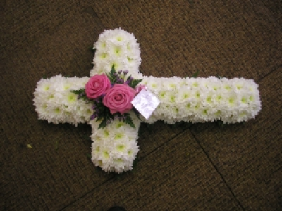 White based cross with coloured top - Order floral funeral crosses today online for delivery In Whitley Bay. Made by The Garden Shop Florist.