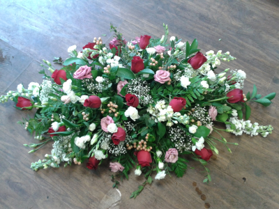 Rose Symphony Spray - Order hand made funeral tributes from The Garden Shop Florist in Whitley Bay. Online flowers delivered today.