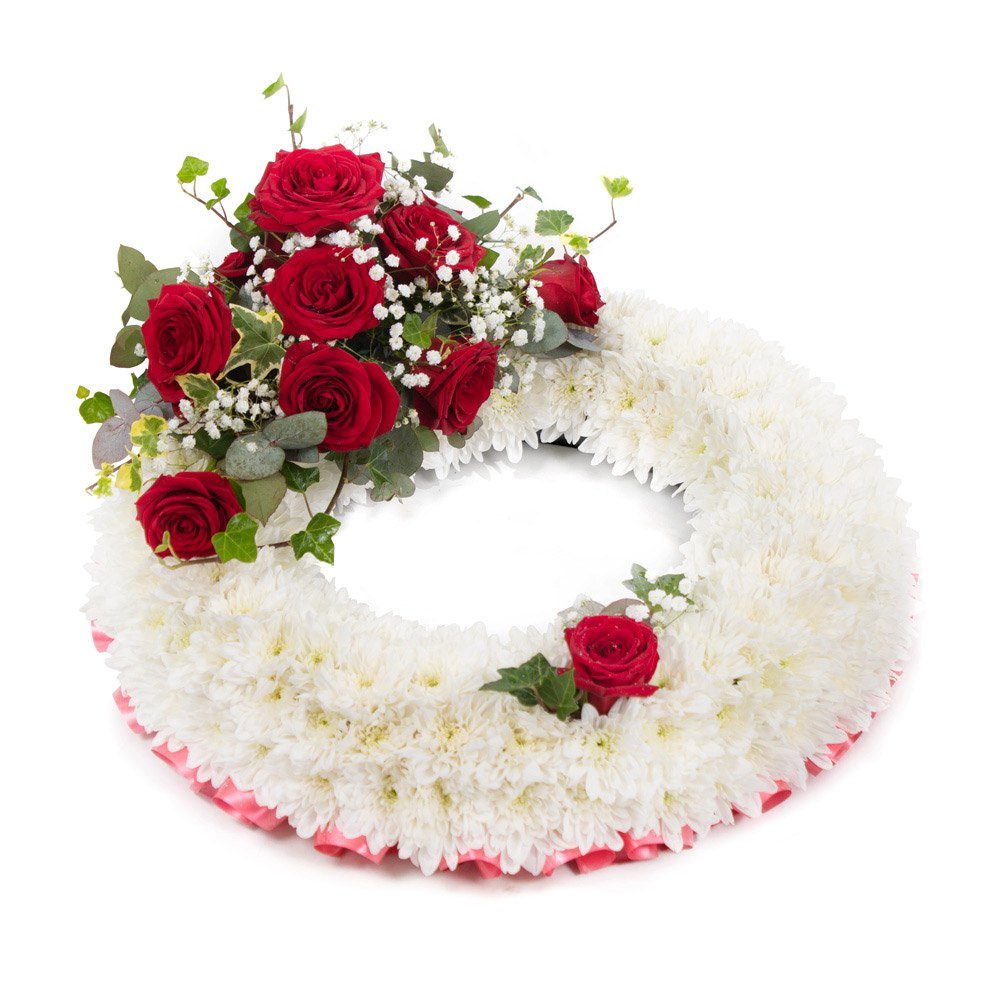 White based Wreath with red top spray SYM-314
